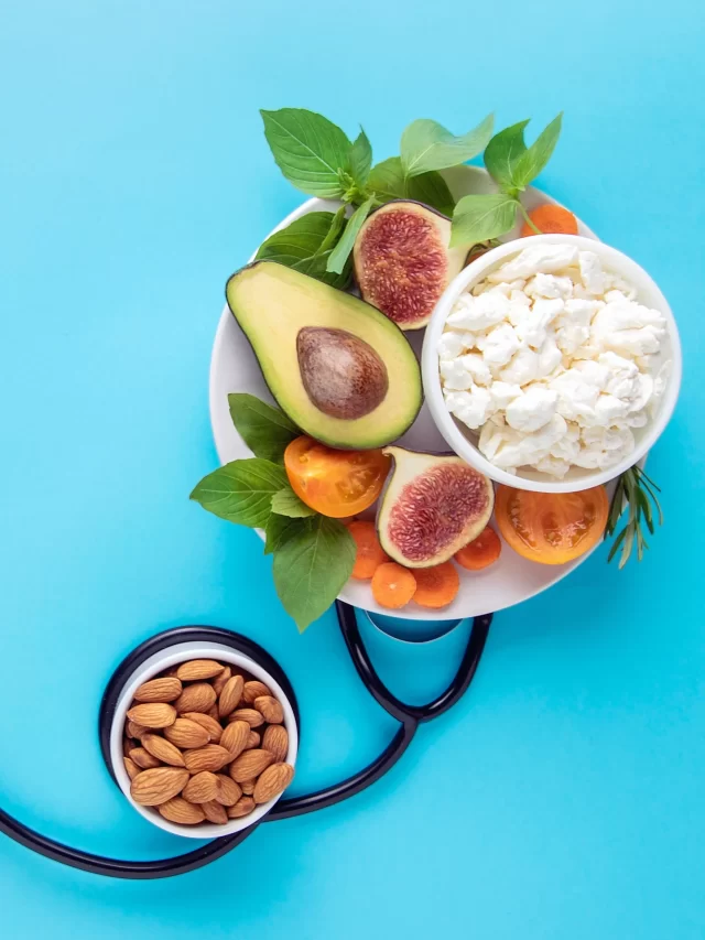 healthy-balanced-nutrition-concept-food-plate-stethoscope-blue-wall-top-view