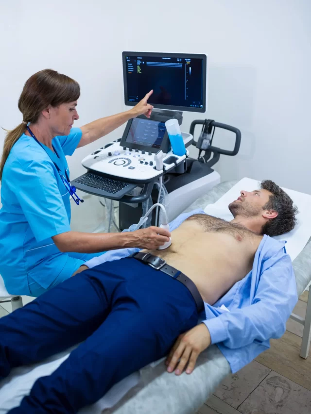 man-getting-ultrasound-abdomen-from-doctor